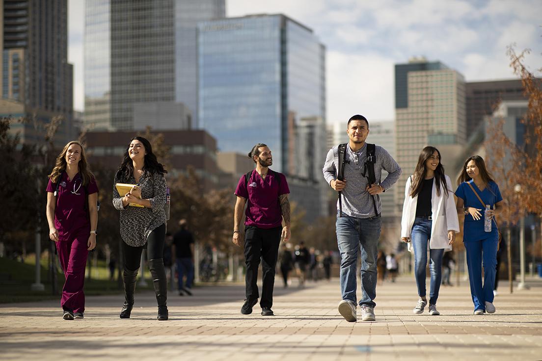 Health Profession Students walking outside on campus